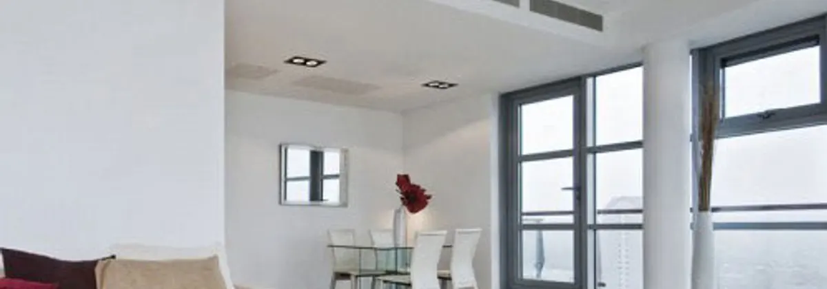 A ducted air conditioning outlet set into a ceiling